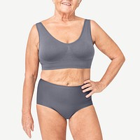 Size inclusive senior woman in brown/blue lingerie studio portrait full body