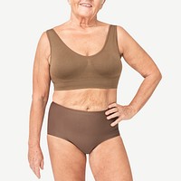 Size inclusive senior woman in brown/blue lingerie studio portrait full body