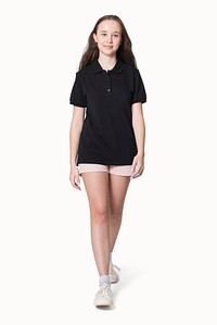 Teenage girl in black polo t-shirt for sporty youth fashion shoot full body