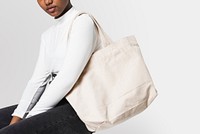 Woman with white tote bag