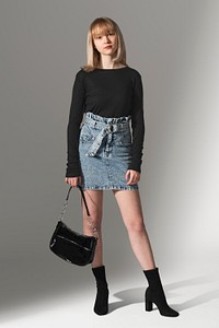 Girls’ black sweater psd mockup with denim skirt for teen’s apparel photoshoot