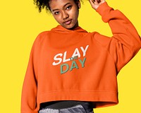 Girl in an orange hoodie winter youth apparel shoot