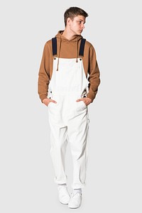 White dungarees mockup psd with brown hoodie streetwear photoshoot