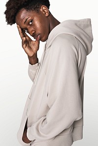Man in beige hoodie winter youth apparel shoot