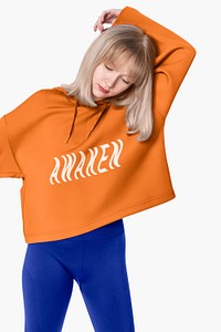 Orange hoodie mockup psd with printed AWAKEN typography street fashion