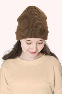 Brown beanie mockup psd with OMG graphic street youth fashion shoot