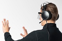 Man with smart headphones touching virtual screen futuristic technology