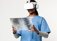 Doctor in VR glasses with medical uniform reading x-ray film 