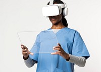 Doctor in VR glasses with medical uniform working on transparent tablet