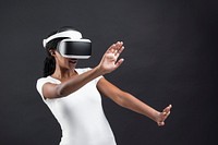 Excited woman with VR headset gaming technology