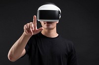 Man wearing VR goggles working on virtual invisible screen futuristic technology