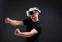 Man with VR playing racing game entertainment technology