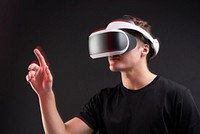 Man wearing VR goggles working on virtual invisible screen