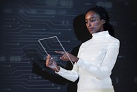 African American woman using transparent tablet futuristic technology