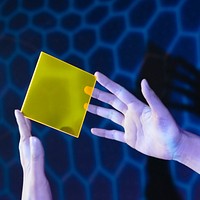 Woman showing yellow interface hologram