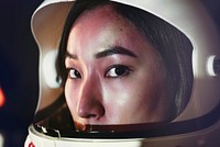 Female astronaut with glass helmet