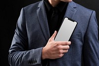 Businessman in suit showcasing futuristic mobile phone technology