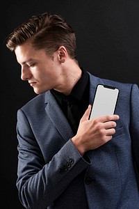 Man in suit presenting his smartphone device