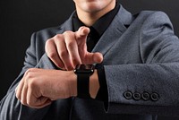 Man touching smartwatch wearable gadget