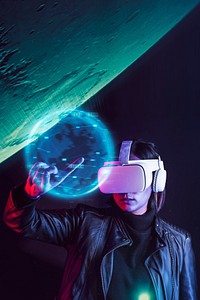 Woman with VR headset touching holography blue globe
