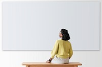 Woman with projector wall mockup psd rear view