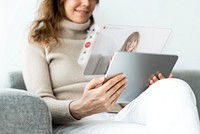 Woman using tablet for video call