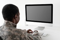 Military officer using computer desktop