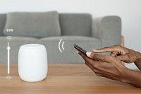Smartphone controlling smart speaker mockup psd virtual assistant