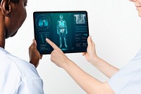 Doctors using tablet to diagnose medical technology