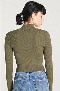 Women in a green turtleneck top with blue jeans mockup