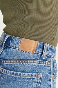 Washed blue jeans with tag mockup