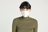 Face mask on a women in a green turtleneck top