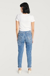 Woman&#39;s white tee with high waisted jeans 