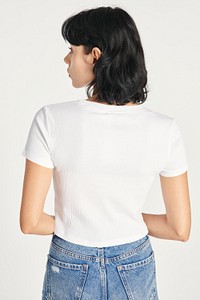 Women&#39;s white crop top and high waisted jeans 