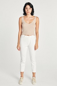 Woman in white pants and a beige cropped top 