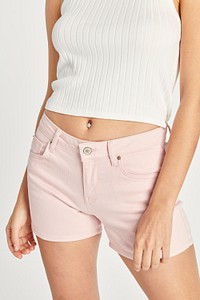 Women's light pink shorts and white crop top minimal outfit 