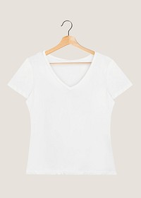 Women&#39;s white t-shirt mockup on a wooden hanger