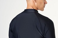 Rear view of a man in a long sleeved swimming top 