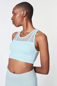 Black woman in a baby blue sports bra 
