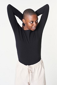 Black woman in long sleeved black t-shirt