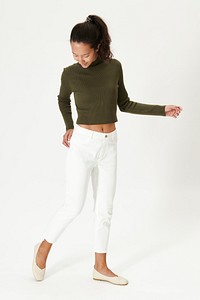Woman in dark green top and white pants