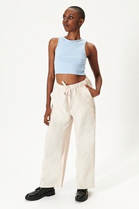 Black woman in a blue crop top and beige pants mockup