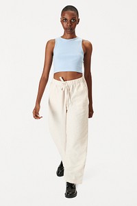 Women's blue crop top with beige pants psd mockup