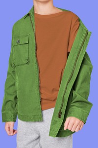 Boy wearing green jacket in studio