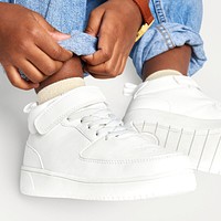 Child with jeans white sneakers mockup studio shot