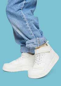 Kid wearing jeans psd white sneakers mockup minimal fashion