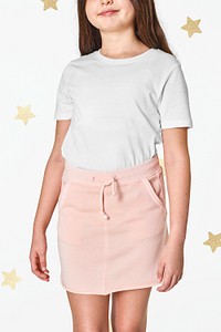 Woman in white t-shirt and pink skirt
