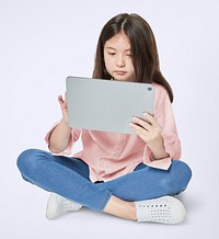 Girl using digital tablet psd mockup