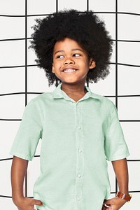 Black boy's green shirt psd mockup in studio