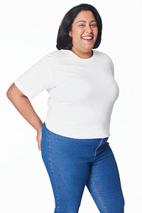 Attractive curvy woman white top and jeans fashion studio shot